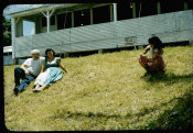 Saipan 1956, No. 0071 Couple on the Grass and One Woman Squatting in a Skirt